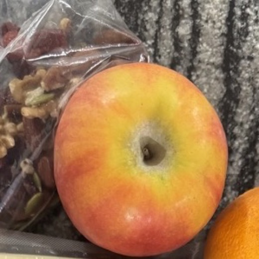 Close-up of the apple from the packed lunch spread